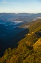Foggy valley at autumn sunrise, Cemerno mountain Royalty Free Stock Photo