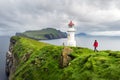 Foggy view of old lighthouse on the Mykines island Royalty Free Stock Photo