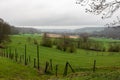 Foggy view over the green hills at the Dutch countryside around Banholt