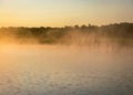 Foggy weather early in the morning on the lake. beautiful wallpapers. a mystical mist vibrates in the lake. summer sunrise