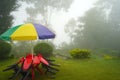 Foggy Weather at Mountain Offbeat Village Lungchok at East Sikkim With Green Grass and Chair Table