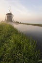 Foggy windmills on a Royalty Free Stock Photo