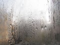 Foggy window. Closeup shot of a steamy window with water drops Royalty Free Stock Photo