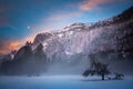 Foggy Yosemite morning with moon and clouds