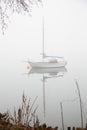 Fogy lake, staying sail-ship park on still water Royalty Free Stock Photo