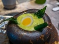 Foie gras with basil cooking in bowl with rice below in fine dining cuisine restaurant Royalty Free Stock Photo