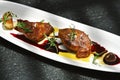 Foie gras grilled served with red berries sauce. Royalty Free Stock Photo