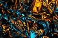 Foil background. Crumpled foil. Abstract background. Wallpaper. Yellow and blue