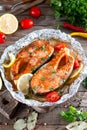Foil pack dinner with fish. Fillet of salmon. Healthy diet food, keto diet, Mediterranean cuisine. Oven-baked hot dinner