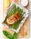Foil pack dinner with red fish. Fillet of salmon with asparagus. Oven-baked hot dinner, keto paleo diet