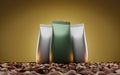 Foil pouch or doypack with coffee beans on golden background. Blank stand up plastic bags mock up banner. Closed silver