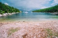 Foki Fiskardo Beach Kefalonia, Ionian islands, Greece. Sea bay with private white yacht in the lagoon Royalty Free Stock Photo