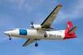 Fokker 50F Cargo Plane on landing approach.