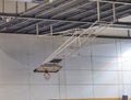 Foldable basketball hoop in the high school gym. Safety nets Royalty Free Stock Photo