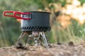 Foldable camping gas fire system with a pot with radiator for fast heating