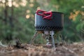 Foldable camping gas fire system with a pot with radiator for fast heating