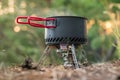 Foldable camping gas fire system with a pot with radiator for fast heating