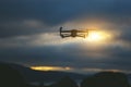 Foldable drone copter flying with a digital camera in mountains. Royalty Free Stock Photo