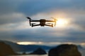 Foldable drone copter flying with a digital camera in mountains. Royalty Free Stock Photo