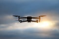 Foldable drone copter flying with a digital camera in mountains. Royalty Free Stock Photo