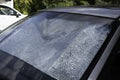 Foldable reflective sunshade on the inside of a car windshield Royalty Free Stock Photo