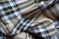 Folded beige, black and white flannel tartan fabric Royalty Free Stock Photo