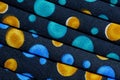 Folded fabric with red, blue, pink, gold and green dots / circles