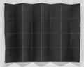 Folded black paper in 32 parts with white background Royalty Free Stock Photo