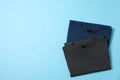 Folded blank t-shirts on blue background Royalty Free Stock Photo