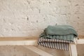 Folded blankets on wooden bench