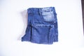 folded blue jeans pants isolated white background Royalty Free Stock Photo