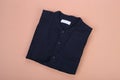 Folded blue navy casual shirt Mandarin collar onpastel background Royalty Free Stock Photo