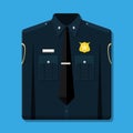 Folded blue policeman uniform with badge.