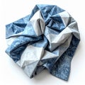 Folded Blue and White Geometric Patterned Cloth on White Background Royalty Free Stock Photo