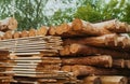 Folded boards and logs on construction site