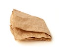 Folded brown crumpled sheet of parchment paper isolated on white background Royalty Free Stock Photo