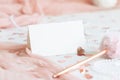 Folded card near pink decorations, hearts and tulle on white table close up, mockup Royalty Free Stock Photo