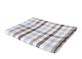 Folded checkered brown towel isolated.