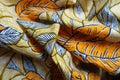 Folded orange, white and blue cotton fabric Royalty Free Stock Photo