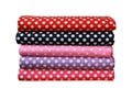 folded colorful polkadot pattern fabrics fold stack isolated on white background, clipping path