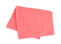 Folded coral kitchen towel on white background
