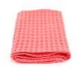 Folded coral kitchen towel on white