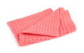 Folded coral kitchen towel on white