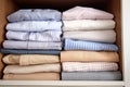 folded cotton shirts aligned in an open wardrobe Royalty Free Stock Photo