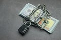 Folded dollar bills bound by metal chain with padlock. Business concept. Royalty Free Stock Photo