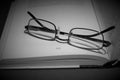 folded eye glasses on a book Royalty Free Stock Photo
