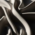 Folded fabric with a smooth texture creating abstract, flowing shapes. The material Royalty Free Stock Photo