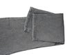 Folded Gray Denim Jeans on White Background Royalty Free Stock Photo
