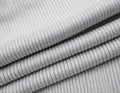 Folded Grey Knitted Fabric Textile Close Up with Soft Texture Material Royalty Free Stock Photo