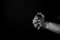 Folded Hands. Hands of a man folded, Praying. Black and white.